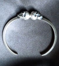 Quarter Floating Skull Triangle Wire Bangle