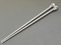 Skull on chopsticks