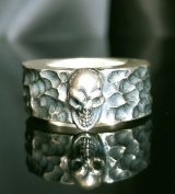 Twelve Small Skull On 11mm Wide Side Flat Chiseled Ring Bold